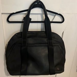 LuLuLemon black gym/travel bag with purple lining